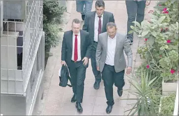  ?? Emre Tazegul Associated Press ?? THE REV. Andrew Brunson, front left, arrives at his Turkish residence after a court released him and allowed him to leave the country. He is expected to meet President Trump at the White House on Saturday.