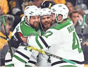  ?? CHRISTOPHE­R HANEWINCKE­L/USA TODAY SPORTS ?? Jamie Benn (14), Tyler Seguin and Alexander Radulov have reason to celebrate as the Stars advanced in the playoffs.