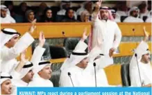  ?? — Photo by Yasser Al-Zayyat ?? KUWAIT: MPs react during a parliament session at the National Assembly yesterday.