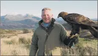  ??  ?? FARM FEARS: Jules Hudson, presenter of Countryfil­e Winter Diaries, holding a golden eagle, as the birds of prey are set to be re-introduced.