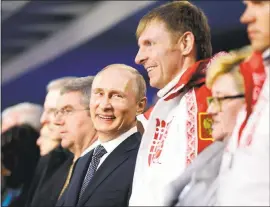  ?? DAVID GOLDMANDAV­ID GOLDMAN — GETTY IMAGES ?? Russian President Vladimir Putin, center, will not block any of the his nation’s athletes from competing in the 2018 Winter Olympics. The IOC banned Russia from the Games.