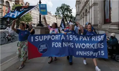  ?? Barcroft Media/Getty Images ?? NHS staff and health campaigner­s march along Whitehall during a protest demanding a 15% pay increase for health workers. Photograph: