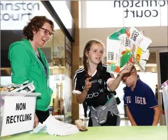  ??  ?? Rachel and Shane Haran from Curry taking part in the Eircodes Recycling Challenge with Imelda Ryan-Jones from Voice in Johnston Court last Friday. Pic: Carl Brennan.