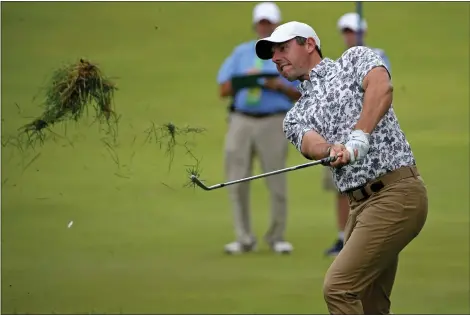  ?? STUART CAHILL / HERALD STAFF ?? Rory Mcilroy chips out of the rough on the 8th on the first day of the U.S. Open on Thursday at The Country Club.