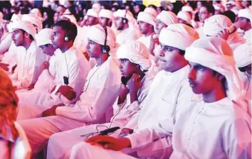  ?? Ahmed Ramzan/ Gulf News ?? Young Emiratis listen to Omar Sultan Al Olama’s address on the second day of the ‘Investing in the Future’ conference in Sharjah yesterday.