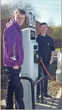  ??  ?? Argyll College UHI students Martin Henricksen, left, and Jamie Summers next to a new charging point.