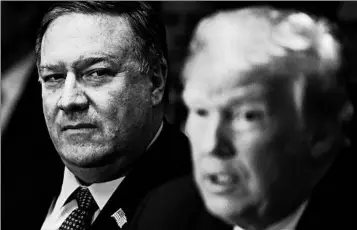  ?? OLIVIER DOULIERY/ABACA PRESS ?? The North Korea trip of Mike Pompeo, left, will wait until trade progress with China is made, President Donald Trump says.