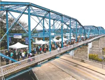  ?? STAFF FILE PHOTO ?? People pack the Walnut Street Bridge for every Wine Over Water.