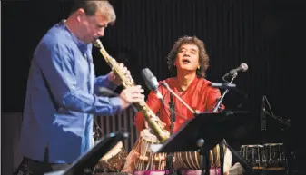  ?? Santiago Mejia / The Chronicle ?? Chris Potter (left) and Zakir Hussain meld jazz and Indian music in a Crosscurre­nts concert.