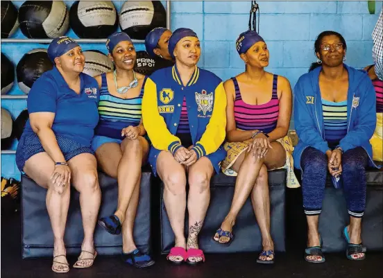  ?? PAM LEBLANC/AMERICAN-STATESMAN PHOTOS ?? Members of Sigma Gamma Rho sorority listen as Cullen Jones talks about the importance of learning how to swim. From left are Virginia Pearson, Tawanda McCall, Talitha Heath, Mina Hill and Yolanda Castillo.