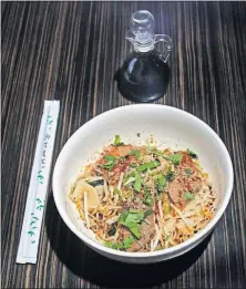  ?? [TOM DODGE/DISPATCH] ?? The biang biang noodles at Jiu Thai