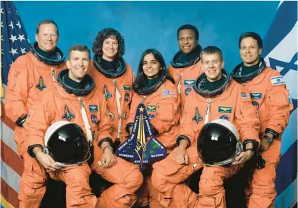  ?? GETTY ?? The crew of Space Shuttle Columbia’s mission STS-107 take a break from their training regime. Seated in front are Rick D. Husband, from left, Kalpana Chawla, and William C. McCool. Standing are David M. Brown, from left, Laurel B. Clark, Michael P. Anderson and Ilan Ramon.