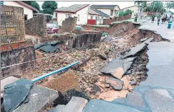  ?? AFP ?? A severely damaged road following heavy rains in Durban, South Africa.