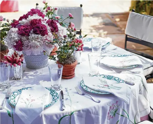  ?? Photograph­y by Quentin Bacon, John Kernick & Sarah Dorio ?? Dinner parties require a well-set table and should always include flowers, says Danielle Rollins, author of of “Soirée: Entertaini­ng With Style.”