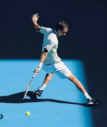  ?? DARRIAN TRAYNOR/GETTY ?? Daniil Medvedev plays a backhand in his match against Botic van de Zandschulp on Saturday.