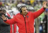  ?? DAVID JABLONSKI / STAFF ?? Ohio State’s Urban Meyer talks to his players during a game against Michigan on Nov. 25 at Michigan Stadium in Ann Arbor, Mich.