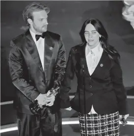  ?? AP PHOTO ?? Finneas O’Connell, left, and Billie Eilish accept the award for best original song for “What Was I Made For?” from “Barbie” during the Oscars on Sunday, March 10, 2024, at the Dolby Theatre in Los Angeles.