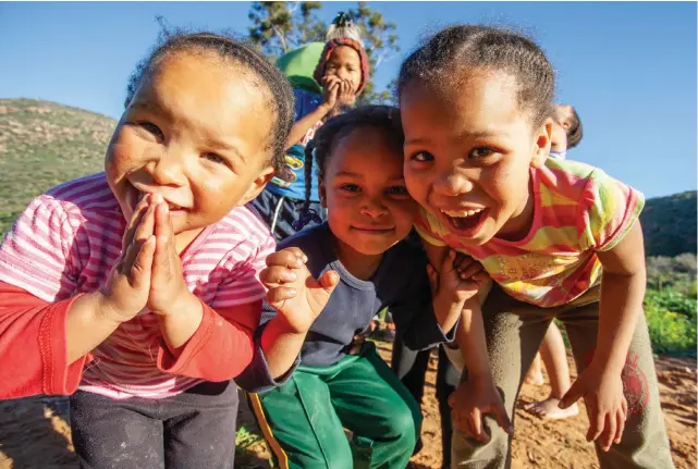  ?? Pictures: Anton Ferreira ?? GOOD CHUCKLE Children on a farm near Clanwillia­m experience the life-changing benefits of laughter yoga.