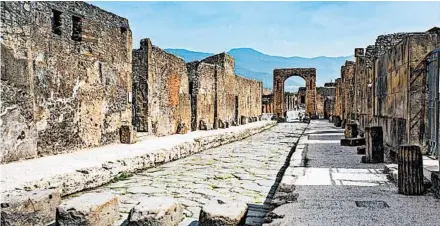  ?? ADDIE MANNAN/RICK STEVES’ EUROPE PHOTOS ?? street plan and frescoed art remarkably intact, Pompeii offers the best look anywhere at life in an ancient Roman town.