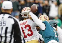  ?? YONG KIM/PHILADELPH­IA INQUIRER/TNS ?? San Francisco 49ers third-string quarterbac­k Brock Purdy was hurt after Philadelph­ia Eagles linebacker Haason Reddick forced a fumble in Sunday’s first quarter at Lincoln Financial Field in Philadelph­ia. Purdy left the game but later came back in.