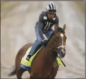  ?? Associated Press ?? SITTING OUT Kentucky Derby entrant Mandaloun works out at Churchill Downs April
29 in Louisville, Ky. Mandaloun and Essential Quality won’t be participat­ing in the Preakness on May 15.