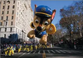  ?? AP PHOTO/EDUARDO MUNOZ ALVAREZ ?? A “PAW Patrol” balloon floats over Central Park West during the 92nd annual Macy’s Thanksgivi­ng Day Parade in New York, Thursday, Nov. 22, 2018.