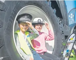  ??  ?? James, 6, and Sarah Reid, 9, at the Police Scotland stand.