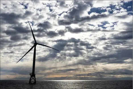  ?? JULIA NIKHINSON — THE ASSOCIATED PRESS FILE ?? A Block Island Wind Farm turbine operates, Dec. 7, 2023, off the coast of Block Island, R.I., during a tour of the South Fork Wind farm organized by Orsted. Unfounded claims about offshore wind threatenin­g whales have surfaced as a flashpoint in the fight over the future of renewable energy.