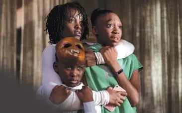  ?? UNIVERSAL PICTURES ?? Lupita Nyong’o, Evan Alex and Shahadi Wright Joseph in “Us,” directed by Jordan Peele.