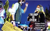  ?? AP ?? oregon state police arrest a protester in portland. —