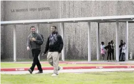  ?? Jon Shapley / Houston Chronicle ?? Students leave La Marque High School at the end of the school day Friday. The school district will be shut down July 1 and absorbed by one or more neighborin­g districts, which will decide whether schools stay open and staff stay employed.