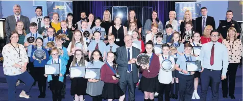  ??  ?? Safety first Councillor McPake (front) congratula­tes all of the winners at the JRSO awards ceremony