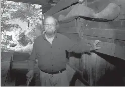  ?? Jim Cole/AP ?? Laureate: Donald Hall, author of numerous poetry books, poses in the barn of the 200-year-old Wilmot farm that has been in his family for four generation­s. Hall, a prolific, award-winning poet and man of letters widely admired for his sharp humor and...