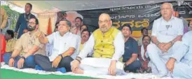  ?? PTI ?? ▪ BJP president Amit Shah (centre), party’s Karnataka CM candidate BS Yeddyurapp­a (right) and other party leaders sit on a daylong fast in Dharwad, Karnataka, on Thursday.