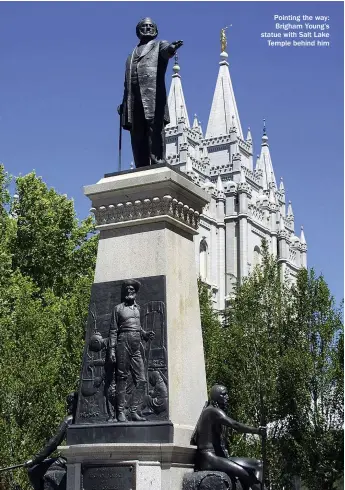  ??  ?? Pointing the way: Brigham Young’s statue with Salt Lake Temple behind him