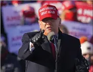  ?? GENE J. PUSKAR — THE ASSOCIATED PRESS ?? President Donald Trump gestures Monday while addressing a campaign rally at the Wilkes- Barre Scranton Internatio­nal Airport in Avoca.