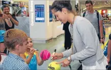  ?? Photo: FAIRFAX NZ ?? Star power: Ana Ivanovic signs tennis balls for young fans at Auckland Airport yesterday.