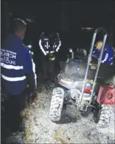  ?? Central Okanagan Search and Rescue ?? Search and Rescue volunteers help get a young man off a cliff near McDougall Rim.