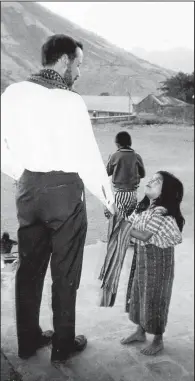  ?? Special to the Democrat-Gazette/Archdioces­e of Oklahoma City Archives ?? The Rev. Stanley Rother is photograph­ed with a child in Santiago Atitlan, Guatemala. Today marks the the first time an American priest and martyr raised in Catholicis­m from birth will be beatified, the final step before canonizati­on.