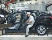  ?? PROVIDED TO CHINA DAILY ?? A worker on the production line of Dongfeng Motor Corp in Guangzhou, capital of Guangdong province.