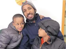  ?? AMY FORLITI /ASSOCIATED PRESS ?? Abdisalan Mohamed Jele, 31, and sons, Hamza Abdisalan Mohamed, 7, left, and Mohamed-Amin Abdisalan Mohamed, 4, are U.S. citizens of Somali descent. His wife and baby girl are waiting to come here.