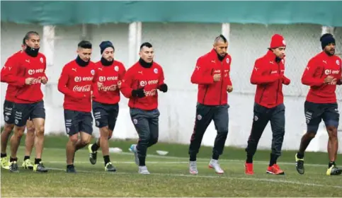  ??  ?? SANTIAGO: Chile players jog during a team training session. Chile will face Argentina in the Copa America final today. — AP
