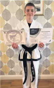  ??  ?? Pleased John Hamill can now call himself a blackbelt in taekwon-do