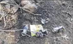  ?? Tim Blydenburg­h / Times Union ?? Garbage left near the shore of the Great Sacandaga Reservoir in the Adirondack Park.