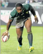  ?? Picture: EPA ?? DEBUT: Siviwe Soyizwapi dots down for the Blitzboks in their third-place win over Australia in Hong Kong yesterday.