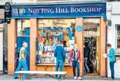  ?? ?? The Notting Hill Bookshop which inspired the film starring Hugh Grant, right, has seen sales double since the pandemic