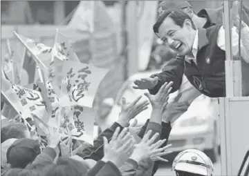  ?? Vincent Yu Associated Press ?? TAIWANESE PRESIDENT Ma Ying-jeou greets supporters in New Taipei. For the last three years, he has built economic relations with China. Critics say the effort has benefited mainly big corporatio­ns.