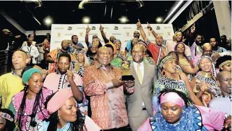  ?? | NOKUTHULA MBATHA African News Agency (ANA) ?? Cyril Ramaphosa and Minister of Arts and Culture Nathi Mthethwa received the Soweto Gospel Choir at Market Square in Newtown, Joburg, yesterday for a congratula­tory message for winning the Best World Music Album Grammy for their album Freedom.