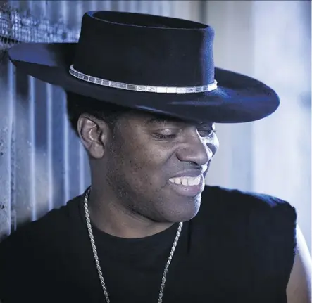  ??  ?? Carvin Jones, 51, credits his musical knowledge to his grandfathe­r, who used to play blues records “24 hours a day.” Jones took up the guitar at seven and formed the first version of the Carvin Jones Band at 19.