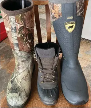  ?? (Arkansas Democrat-Gazette/Bryan Hendricks) ?? Excellent severe cold weather boots include (from left) Muck’s Arctic Ice, Lowe’s Nabucco Evo Gtx and Irish Setter’s MudTrek.